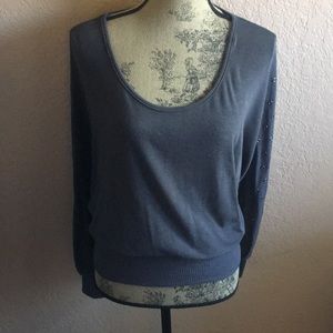 Grey oversized long sleeve top with studded sleeve